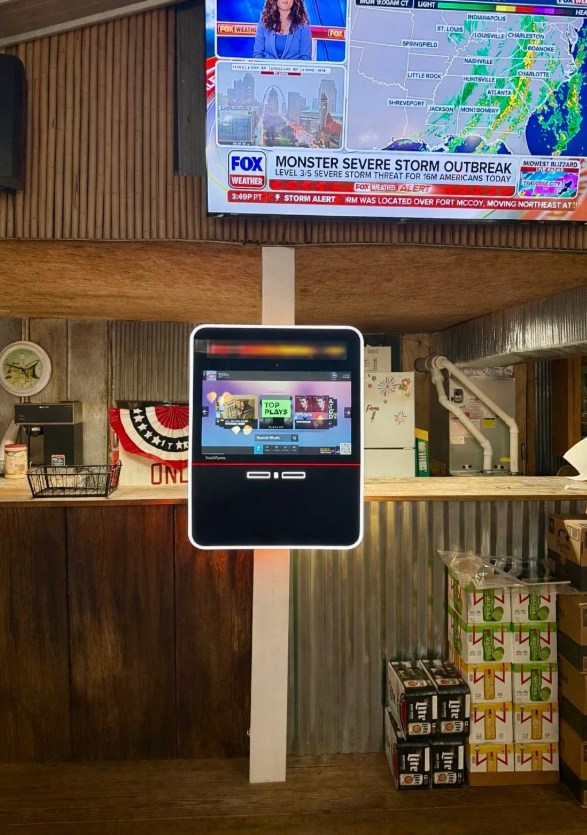 TouchTunes jukebox installed behind the bar at Cherokee Heights Boat Dock