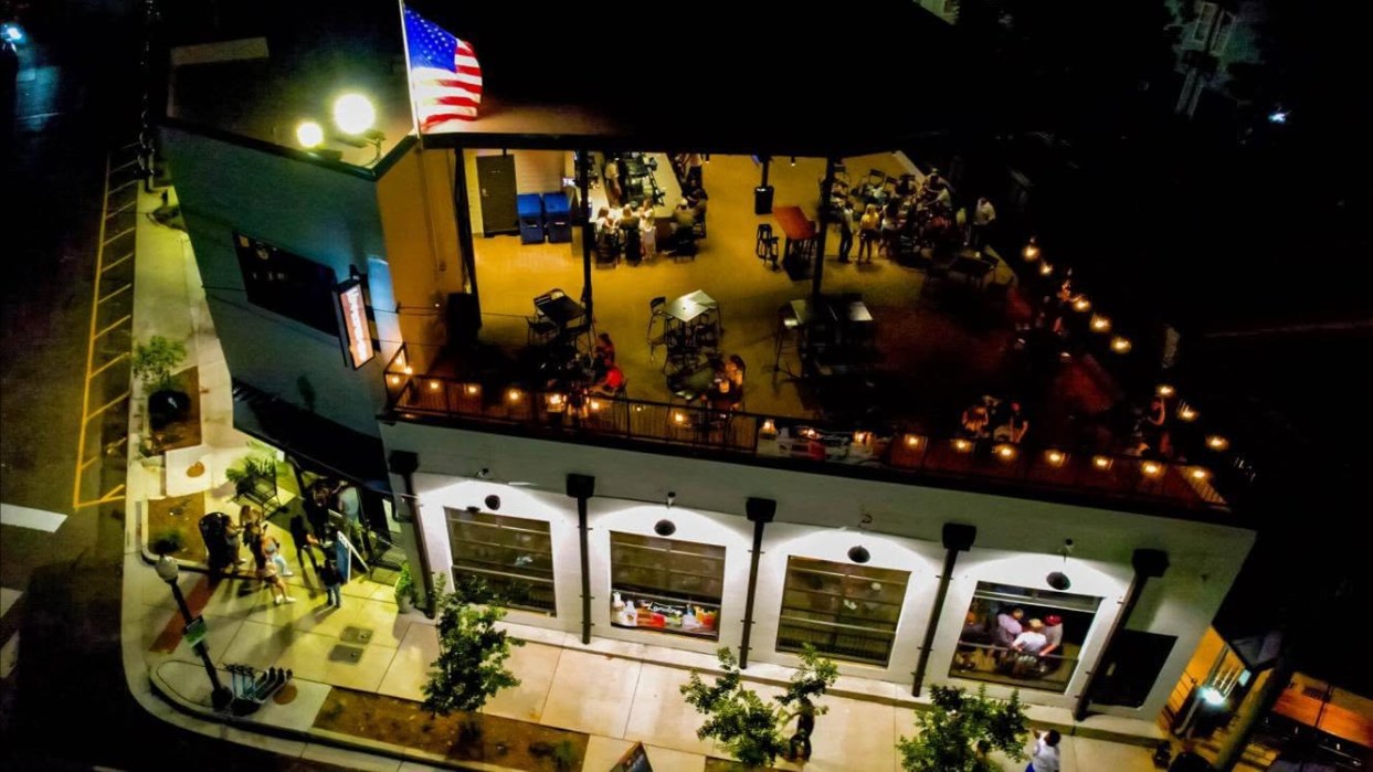 Aerial night view of a rooftop venue in the Cotton District, Starkville, Mississippi