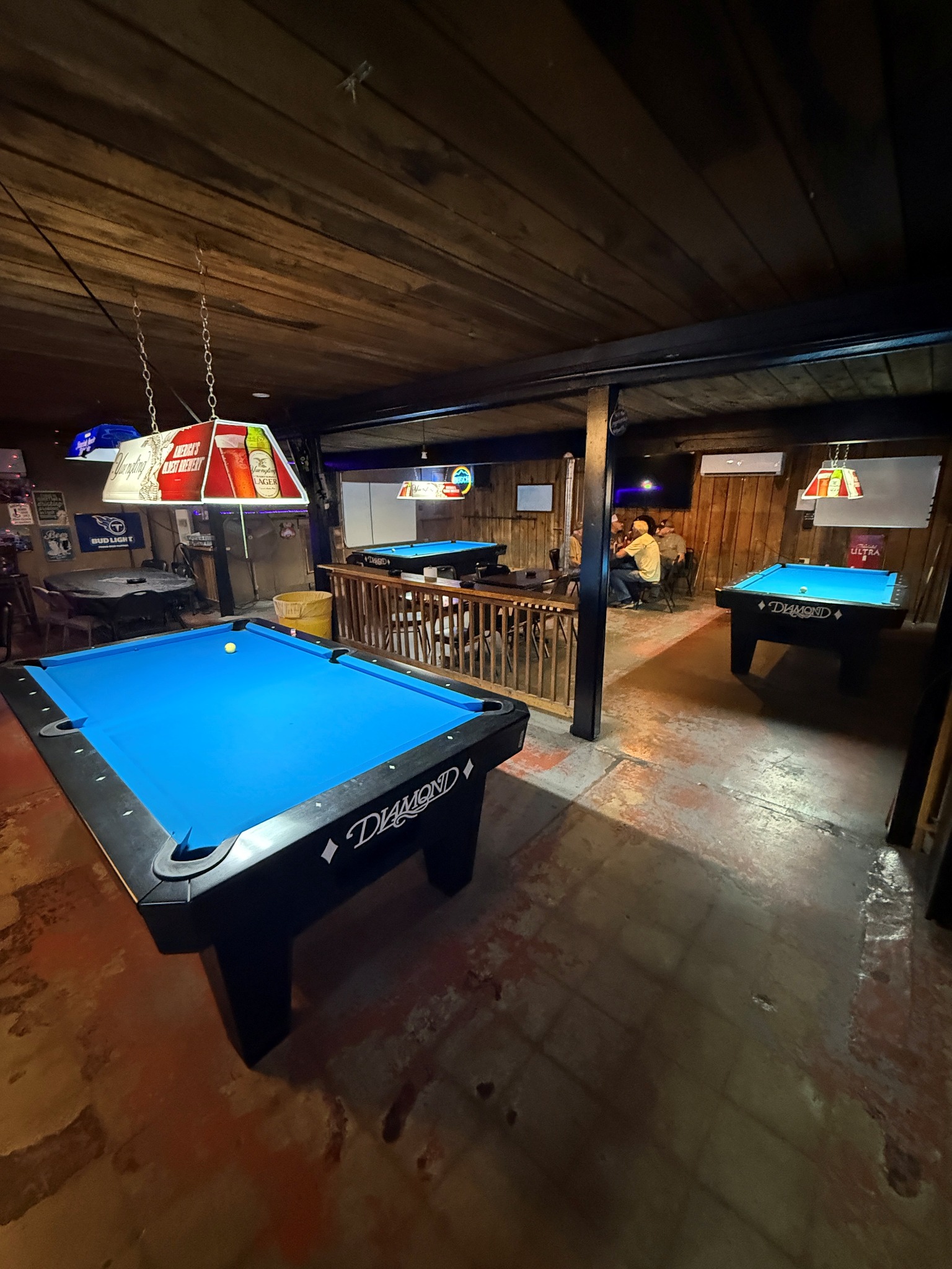 Coin-operated pool tables installed at a local bar